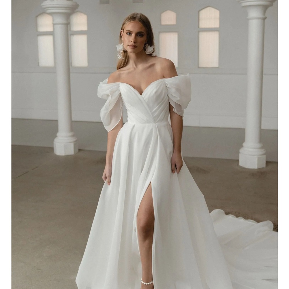 White Off-the-Shoulder Wedding Gown with Puff Sleeves and High Slit